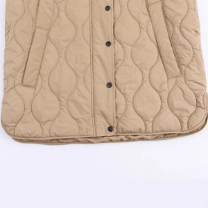 Women's khaki quilted hooded vest featuring wavy stitching and matte black button closures