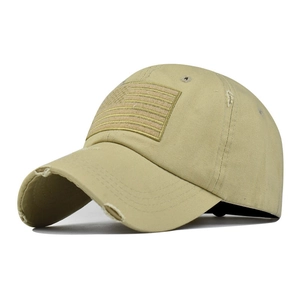 Close-up of distressed khaki cotton baseball cap with vintage American flag patch