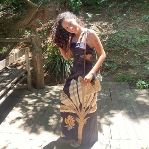 Detail of waist cut-out on floral print maxi dress with tropical botanical pattern