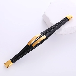 Multi-layer black leather woven bracelet with gold meander pattern metal charms