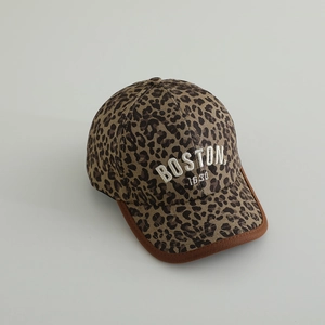 Detail of leopard print baseball cap with Boston 1630 embroidery and suede brim