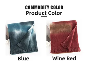 Detailed close-up of thick pashmina scarves in blue and wine red with fringe trim