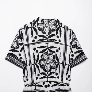 Women's tropical print short jumpsuit with Cuban collar and elastic waist back view