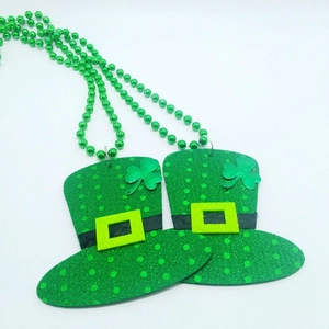Detail of St. Patrick's Day green bead necklace with glittery shamrock top hat pendants