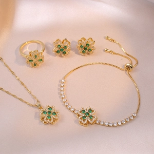 Elegant four-piece gold jewelry set with green zircon four-leaf clover pendants