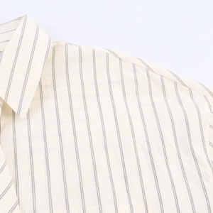 Close-up of retro striped shirt collar showing detailed woven texture and stitching