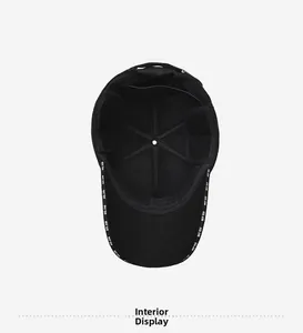 Close-up of the internal structure of the black baseball cap showing the inner lining and stitching