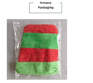 Christmas jester hat with red and green velvet stripes in clear protective packaging