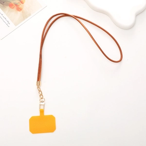 Brown leather phone lanyard neck strap with gold metal buckle and yellow gasket on white background