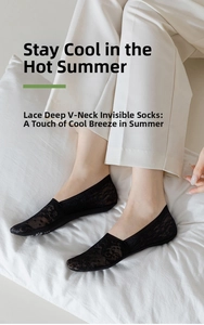 Detail of black floral jacquard lace invisible socks on foot for summer breathability