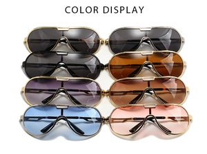 Selection of eight retro oversized aviator sunglasses in various colors on white backdrop