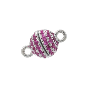 Macro shot of silver magnetic sphere clasp set with vibrant rose pink zircons for jewelry