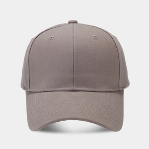 Detailed close-up of dark khaki baseball cap with twill texture and six-panel crown