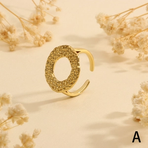 Detailed view of 18K gold plated hammered texture oval ring with minimalist open design