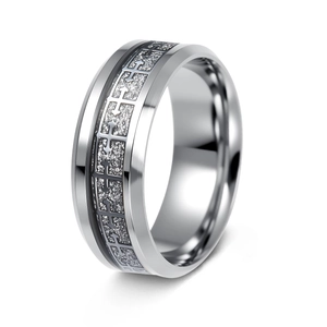 Detailed view of silver stainless steel ring with textured geometric inlay and matte finish
