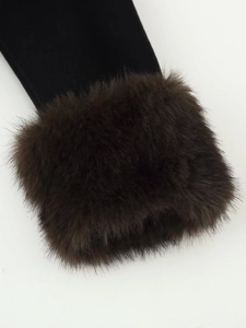 Close-up of black woolen coat sleeve featuring luxurious fluffy dark brown fur cuffs