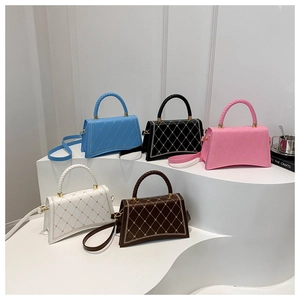 Quilted diamond pattern crossbody bags in five colors with woven handles and gold studs