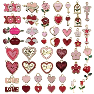 Detail of pink and red enamel heart charms and rose pendants for DIY jewelry making