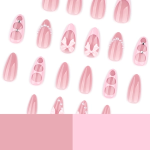 Pink press-on nail set featuring sweet 3D bow designs and pearl French tip almond nails