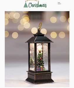Close-up of vintage bronze Christmas lantern with miniature tree and snow scene inside
