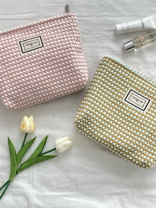 Large capacity waffle texture makeup bags with Pleasant Time labels in pink and blue colors