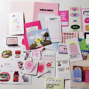 Detailed flat lay of pink stationery set featuring aesthetic stickers and memo cards
