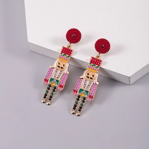 Detail of nutcracker dangle earrings with colorful beads and sparkling crystals