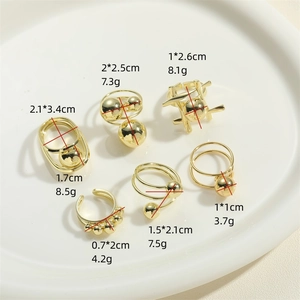 Adjustable golden metal rings and earrings set with bead and geometric designs