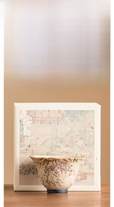 Detail of hand-painted wisteria ceramic teacup with gold trim in a premium gift box