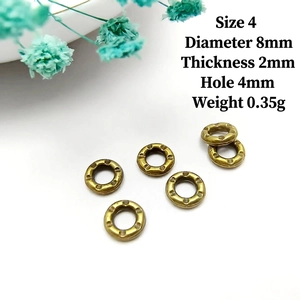 Macro detail of antique bronze textured spacer rings with 8mm diameter for jewelry making