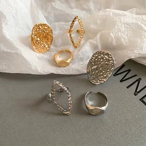 Elegant 6-piece gold and silver mixed metal ring set with lava texture and oval designs
