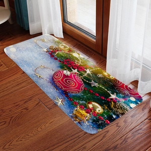 Detailed close-up of flannel Christmas mat with red ornaments on dark wood floor