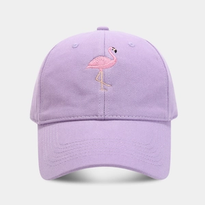 Close-up of pink flamingo embroidery on purple cotton twill baseball cap fabric