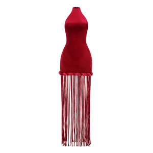 Detail of red velvet mini dress featuring intricate woven hem with long hanging tassels