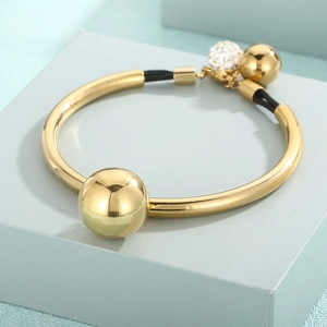 Gold titanium steel bead bangle with black woven rope and sparkling rhinestone charms
