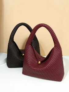 Handcrafted woven crescent shoulder bags in dark red and brown with gold sphere clasp