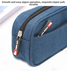 Detail of high-capacity blue oxford pencil case featuring durable rubber dual zippers