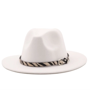Close-up of a white wool fedora hat featuring a stylish zebra print band and silver buckle