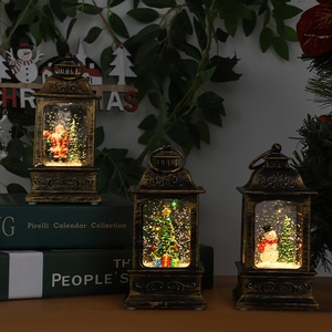 Vintage bronze Christmas water lanterns with Santa and Snowman for festive tabletop decor