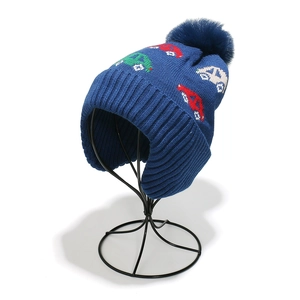 Detail of kids knit aviator hat showing the soft navy blue texture and car pattern