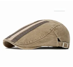 Detail of khaki washed cotton flat cap with vertical stripes and metal buckle adjustment