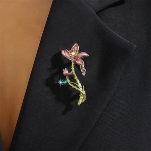 Exquisite enamel lotus flower brooch with rhinestones on a black suit jacket lapel