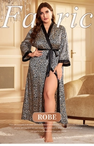 Detail of luxury leopard print satin robe with black trim and matching waist tie