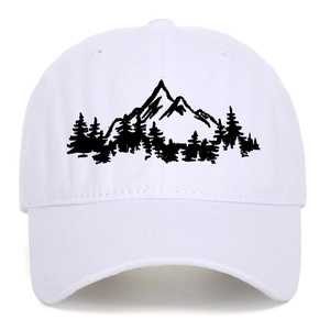 Close-up of white baseball cap with black mountain forest embroidery and fine canvas texture