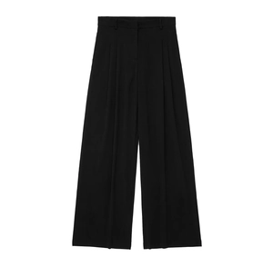 Detail view of high-waisted black wide-leg trousers with premium drape and pleated design