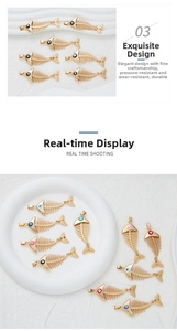 Detail of fish bone pendants with colorful evil eye inlay and hollow gold alloy design
