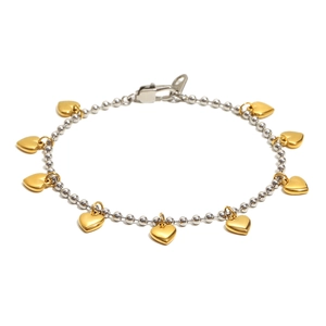 Polished silver beaded chain bracelet with gold heart charms on a white background
