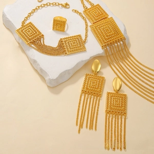 Detailed view of gold plated jewelry set featuring geometric frames and long tassels