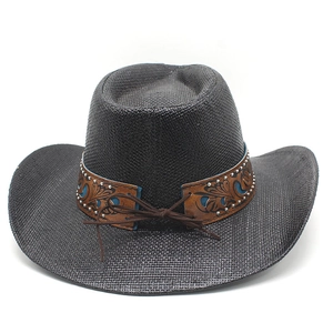 Detail of black cowboy hat featuring a brown carved band with blue patterns and silver rivets