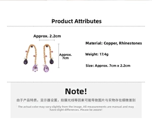 Detail of gold metal earrings with copper material and sparkling purple rhinestones